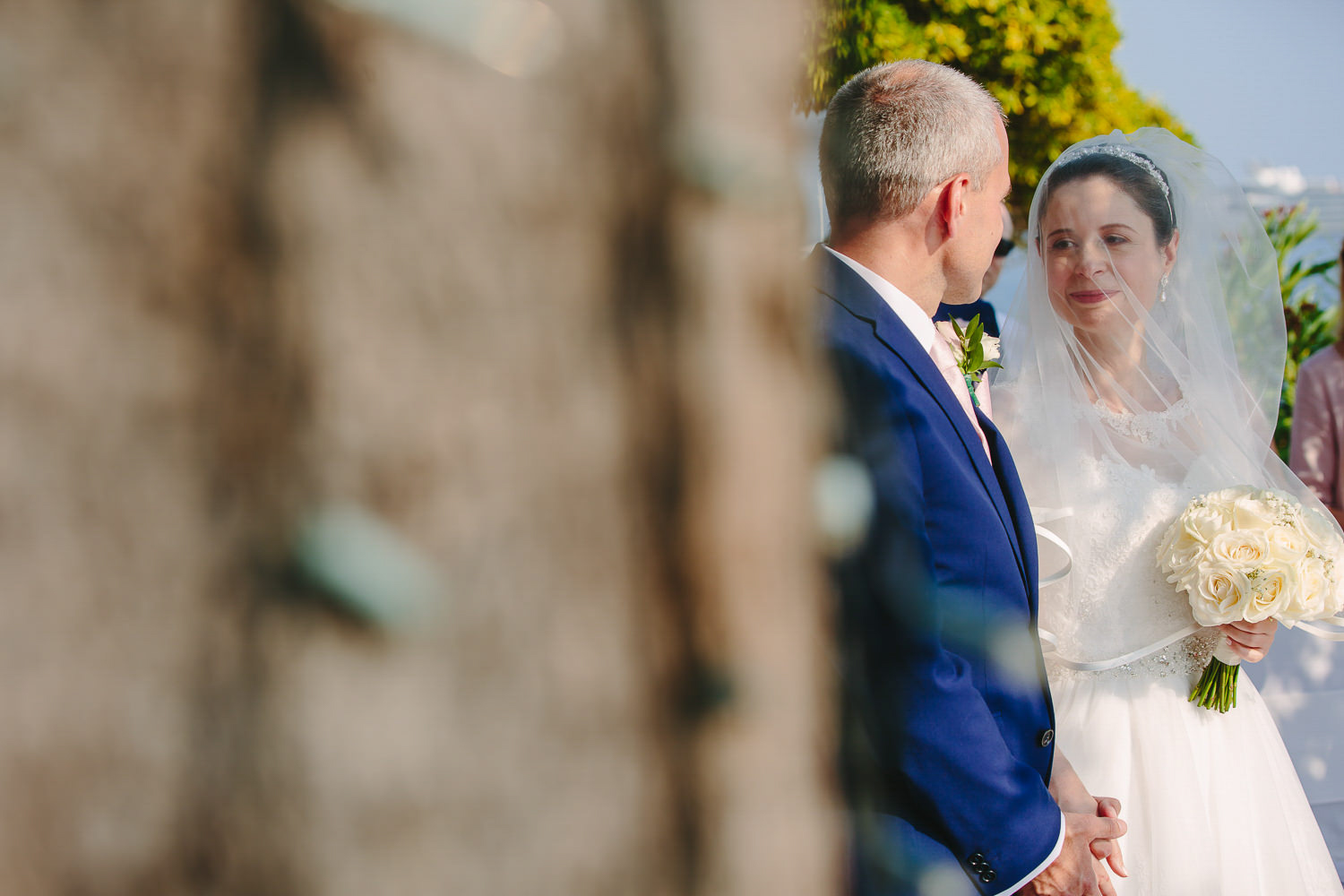 Bride and groom during outdoor wedding ceremony