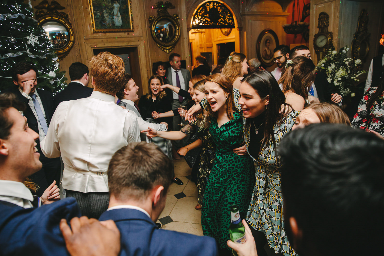 Wedding guests dancing, indoors, wedding venue