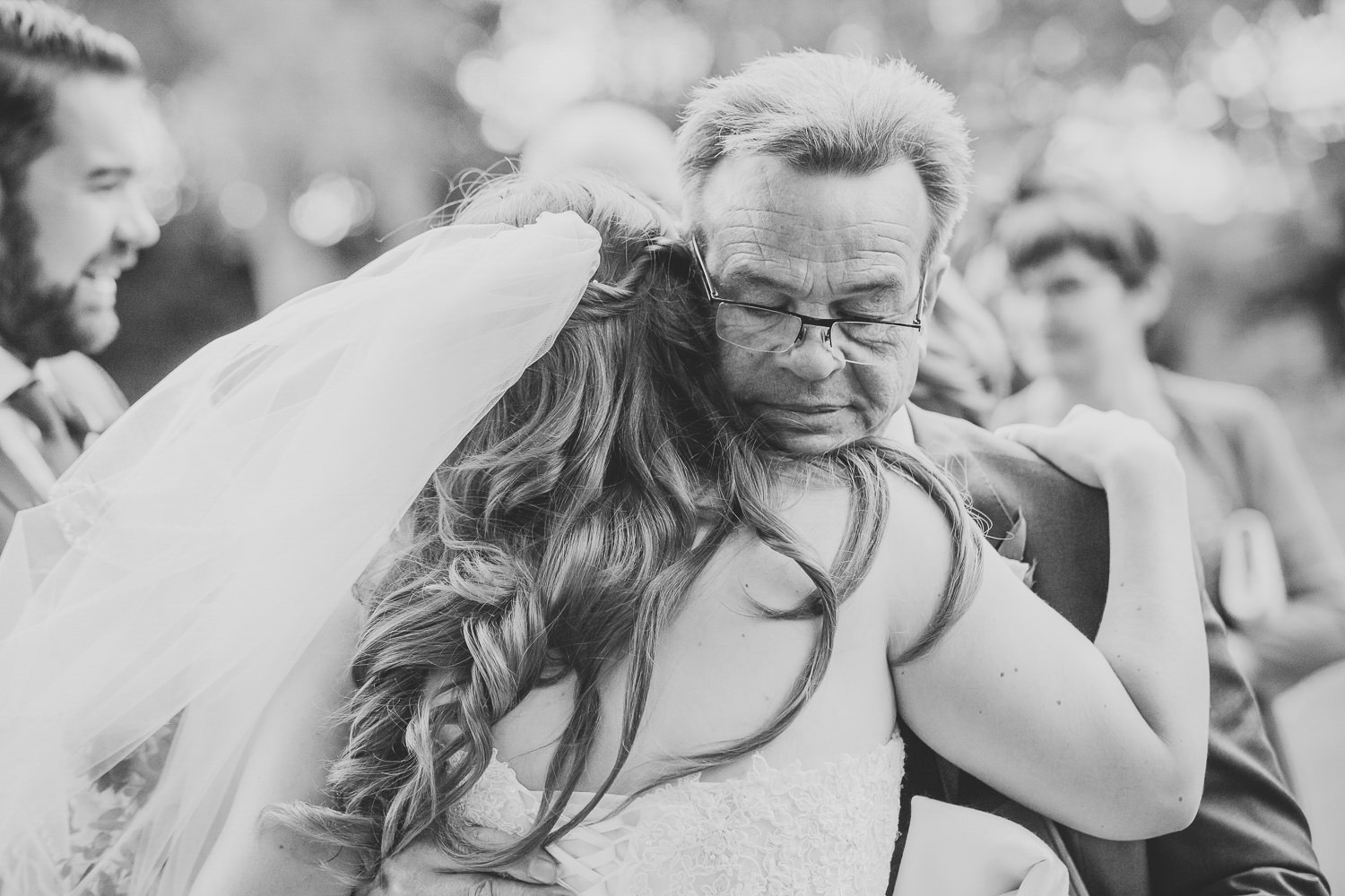 Bride hugging father