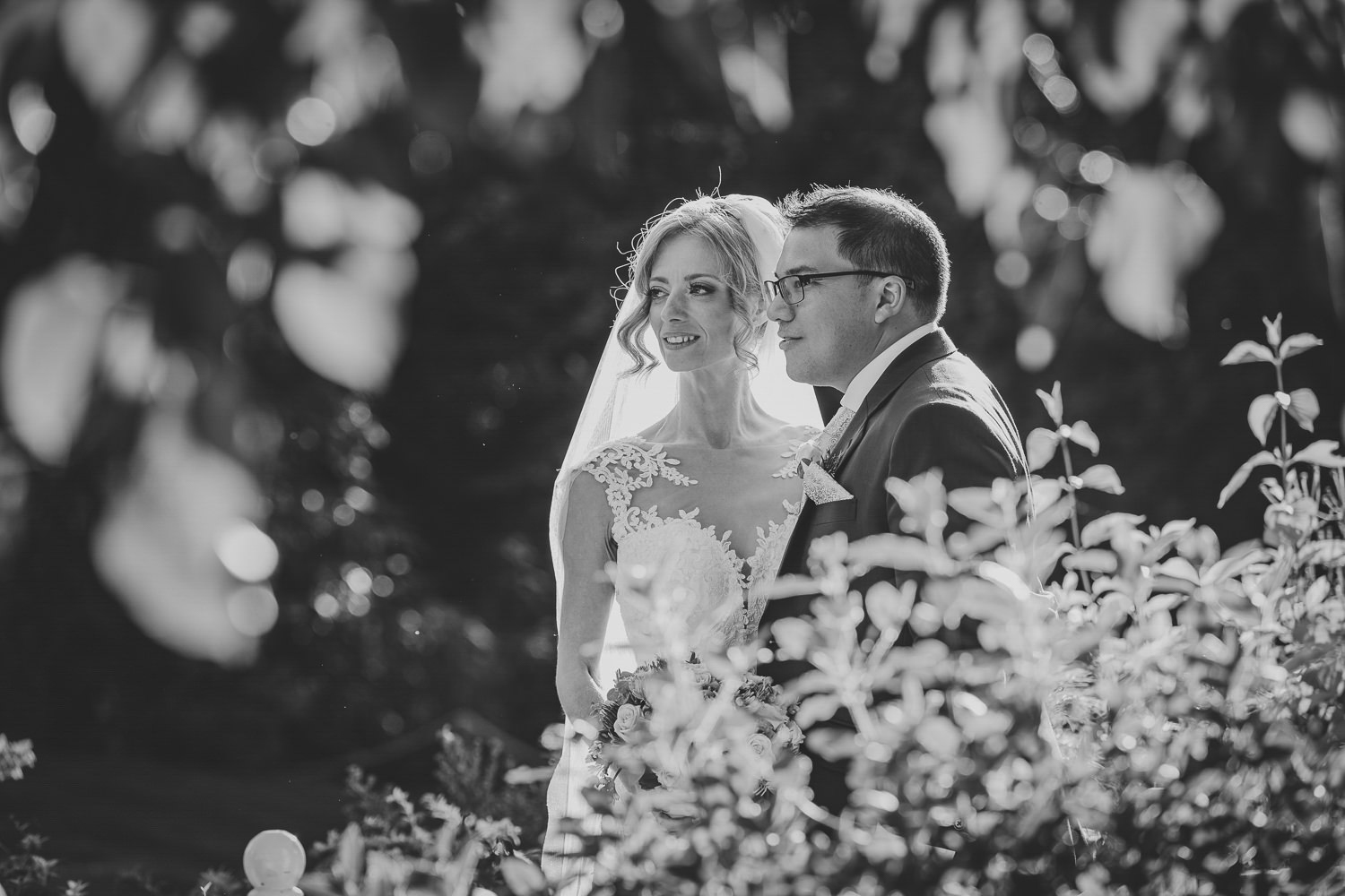 Bride and groom portrait, sunshine, black and white