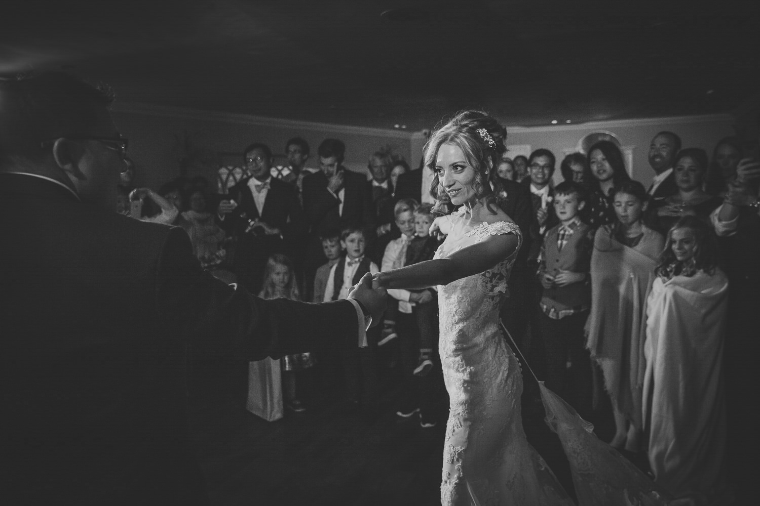 Bride and groom dancing, black and white photo