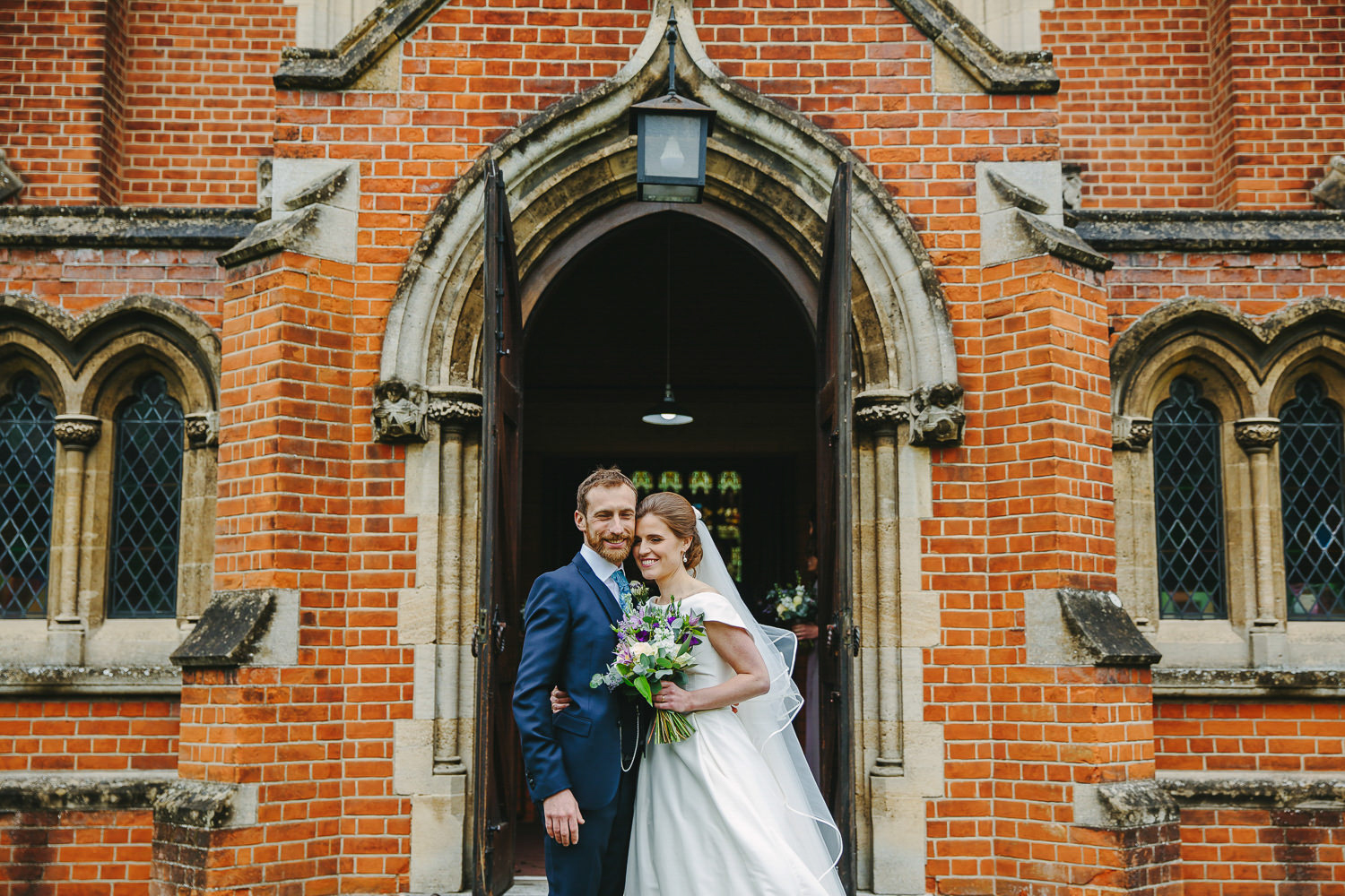 Bride and groom in front of a church
