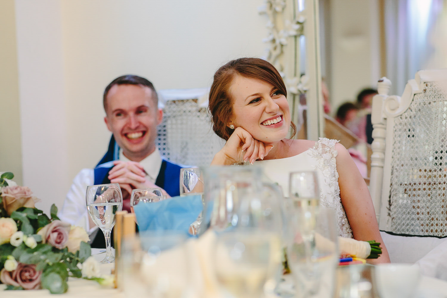 Bride and groom during wedding speeches