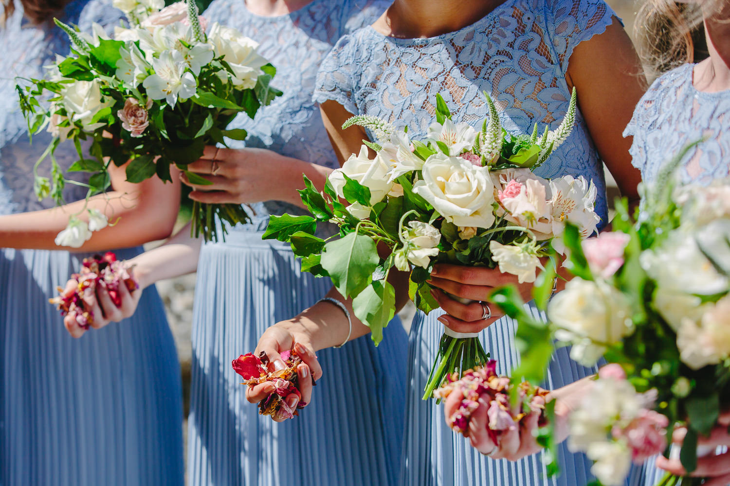 Bridesmaids, flowers and handfuls of confetti