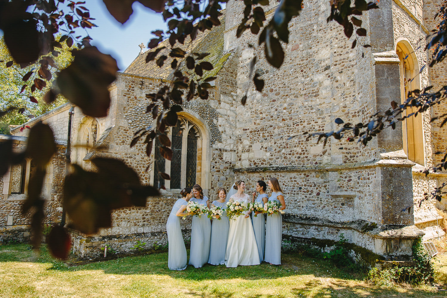 Bride and bridesmaids outside a church