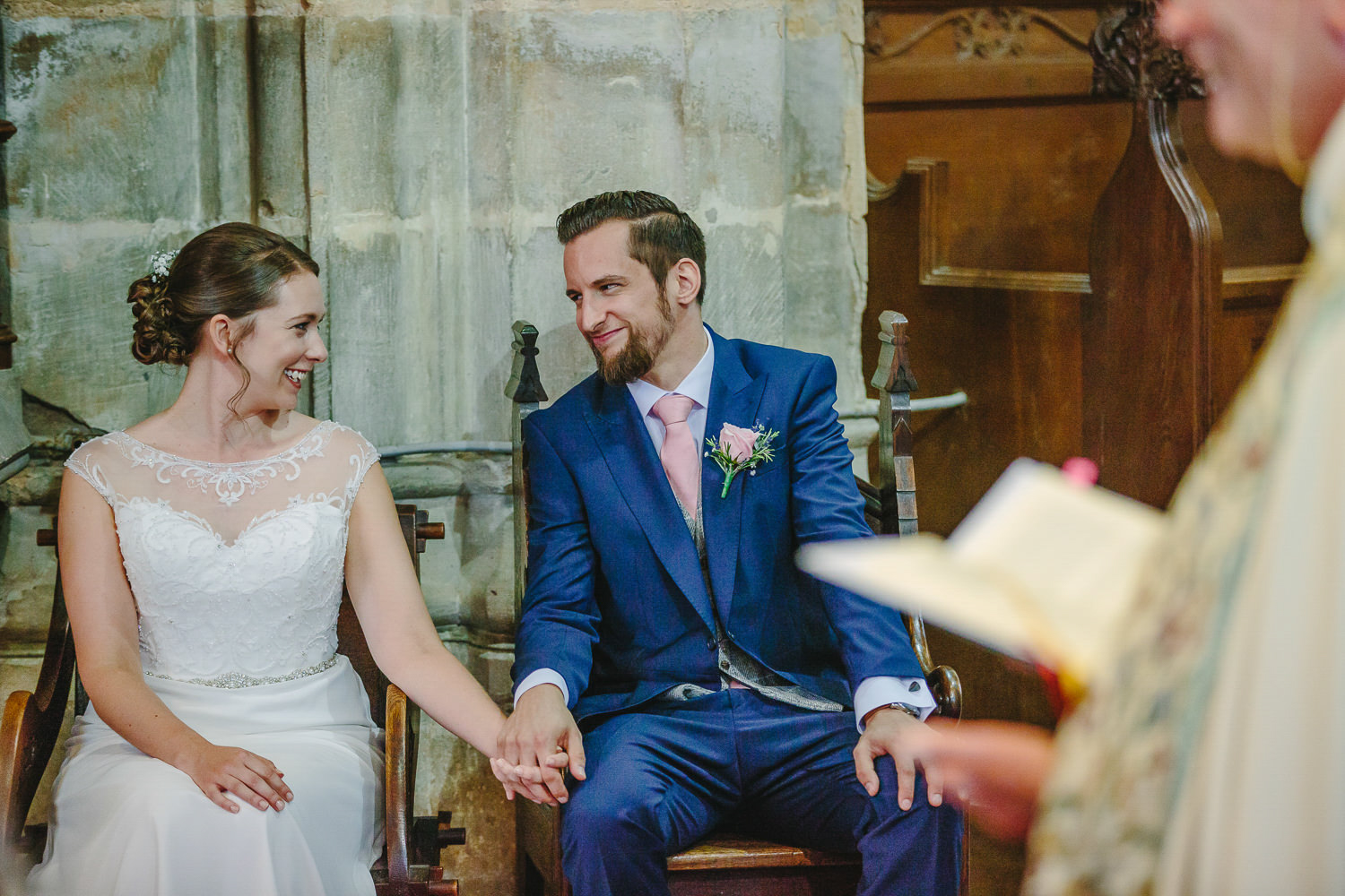 Bride and groom looking at each other, wedding ceremony, church