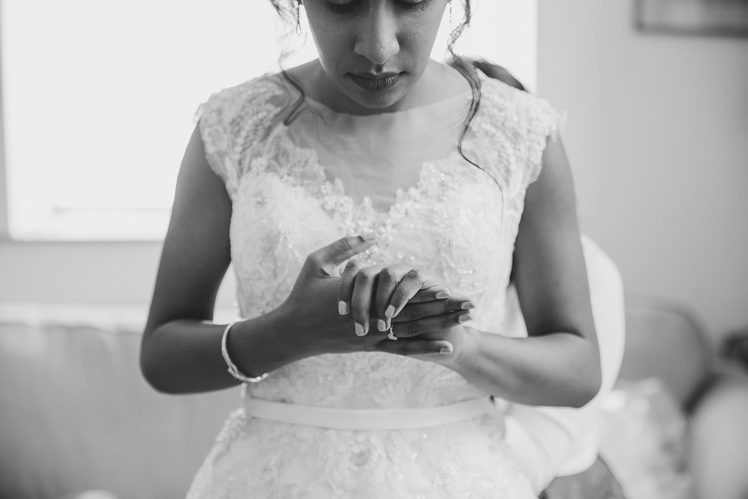 Bride clasping hands