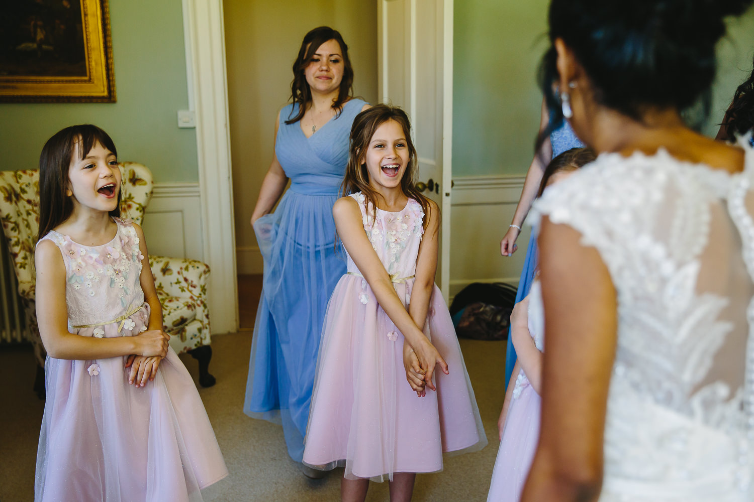 Bridesmaids and flower girls looking happy