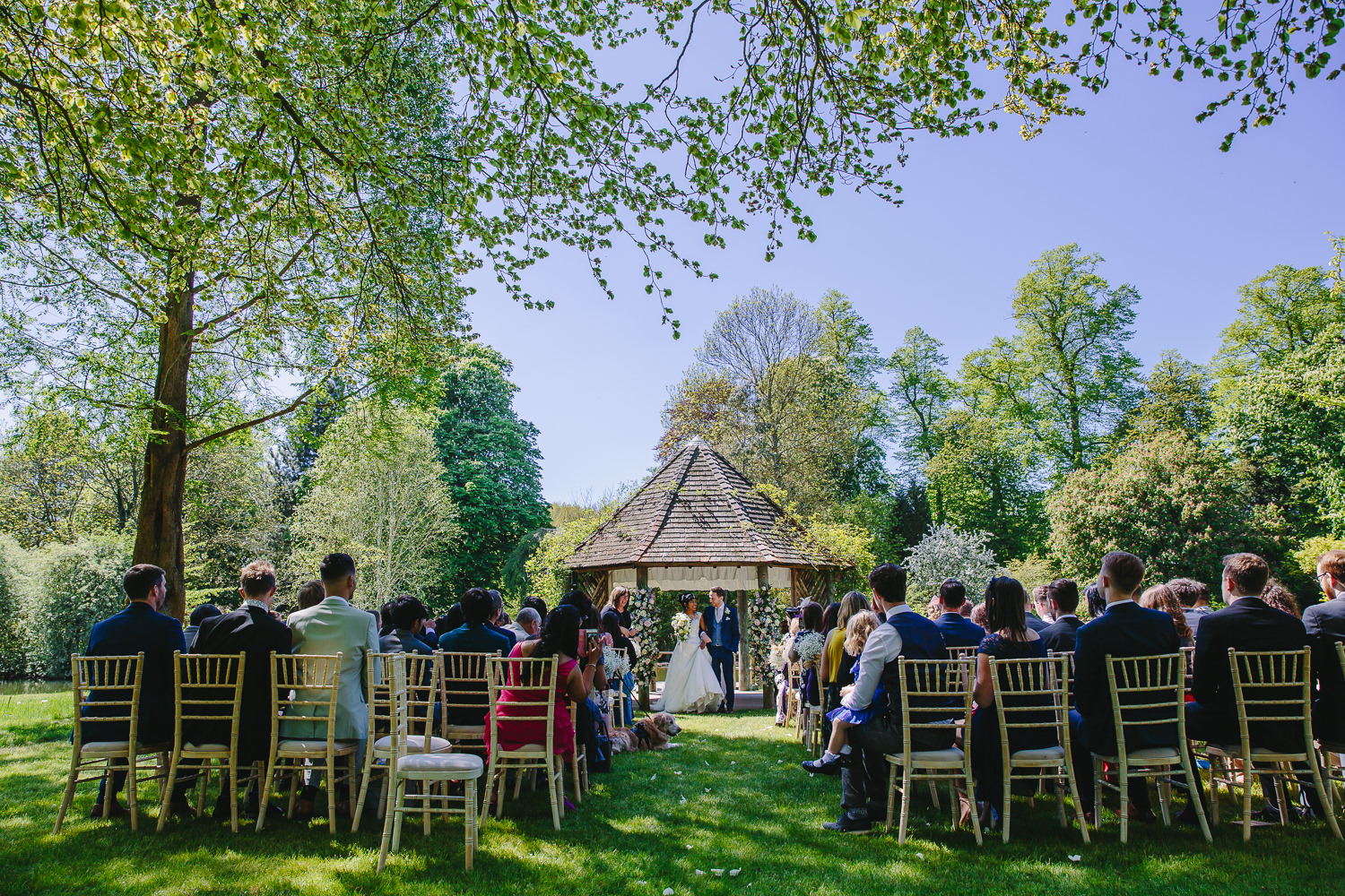 Bride and groom in outdoor ceremony gazebo at Chippenham park