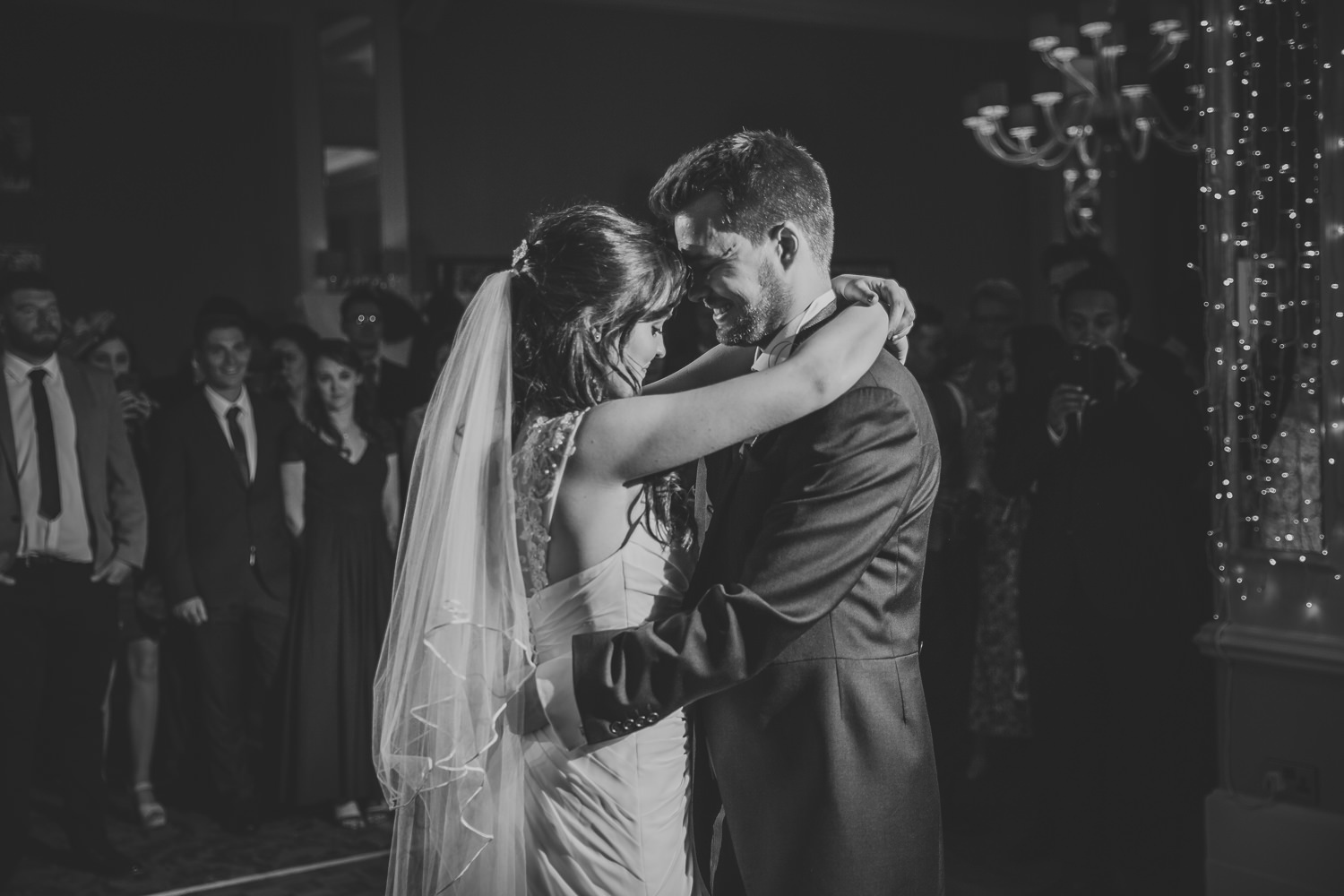 Black and white wedding photo of bride and groom during first dance in Richmond Hill Hotel, London