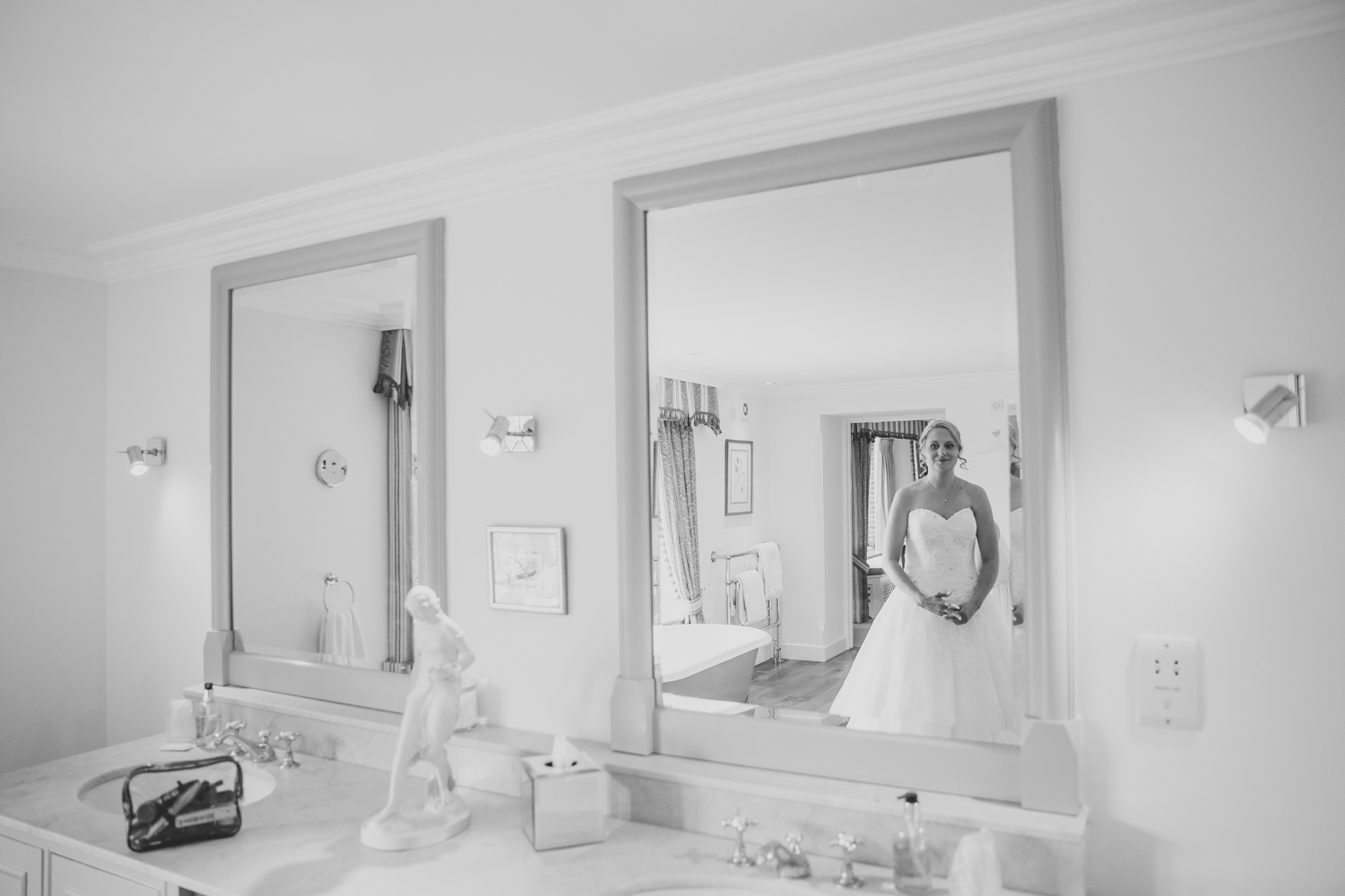Ely wedding photographer photo of bride looking in mirror at The Old Hall Ely