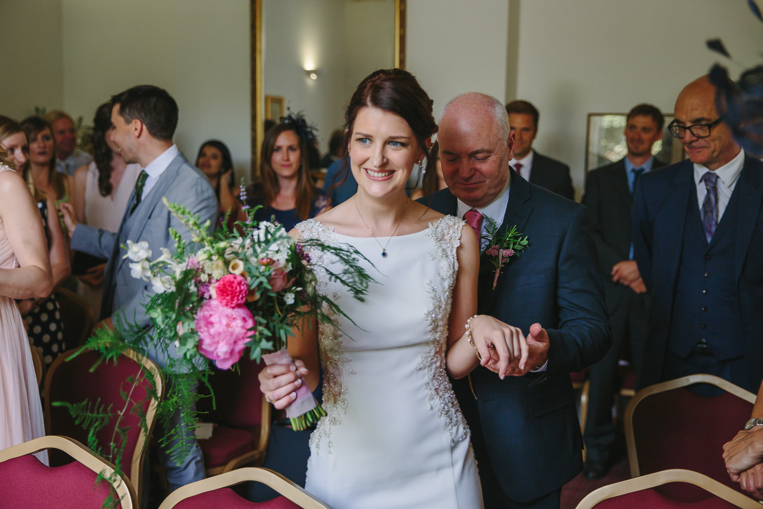 Bride arriving for the wedding ceremony inside Ely registry office, photographed by an Ely Wedding Photographer