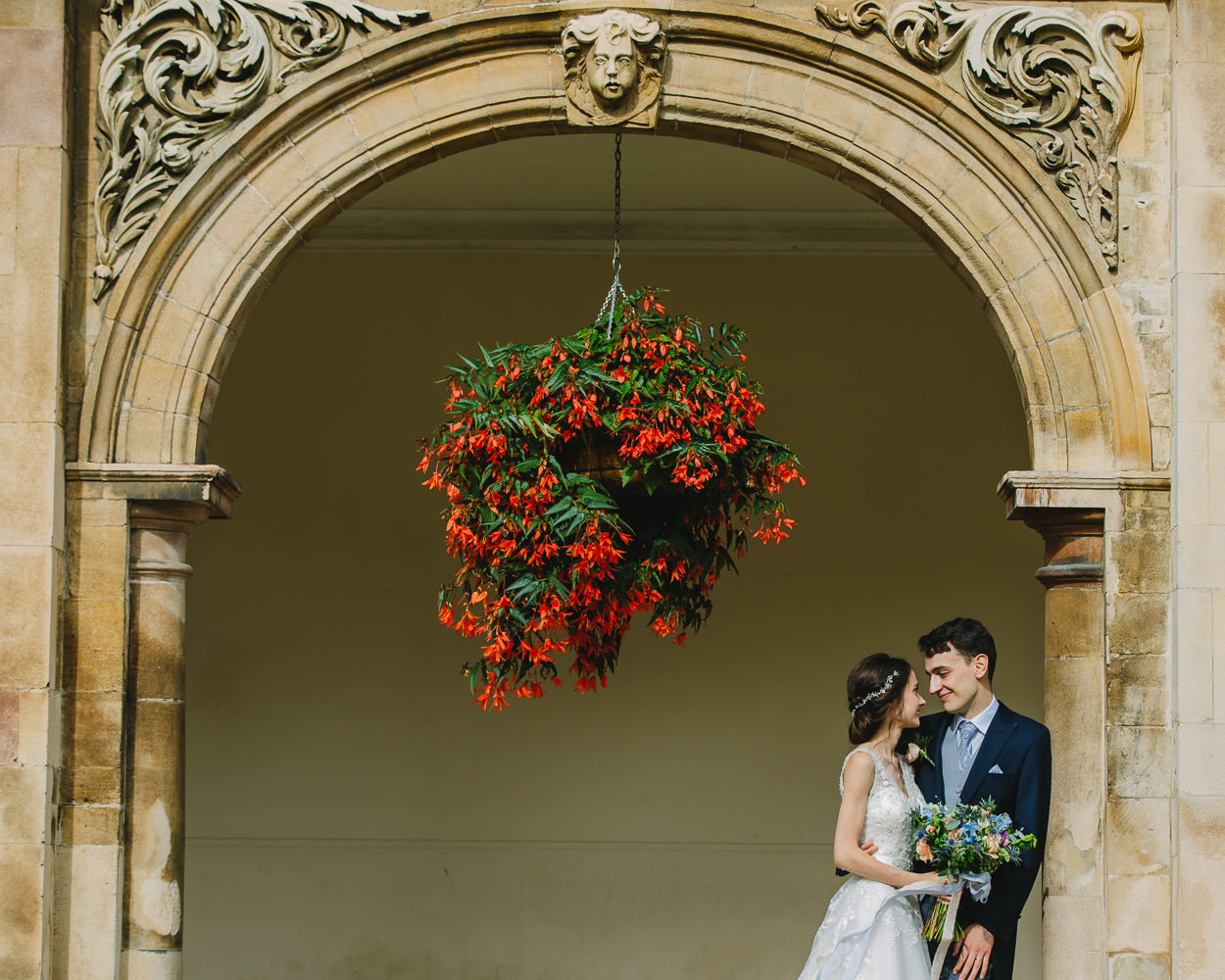 Bride and groom portrait in the cloisters of Magdalene College Cambridge University