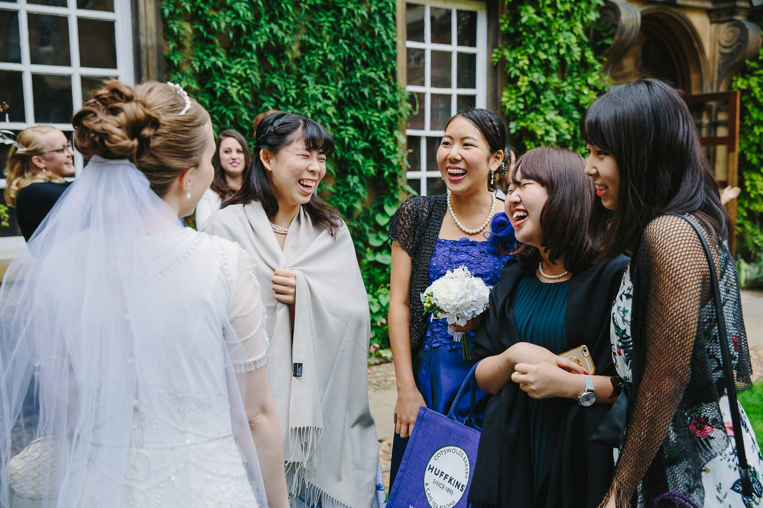 Guests laughing Trinity Hall College Cambridge University Wedding