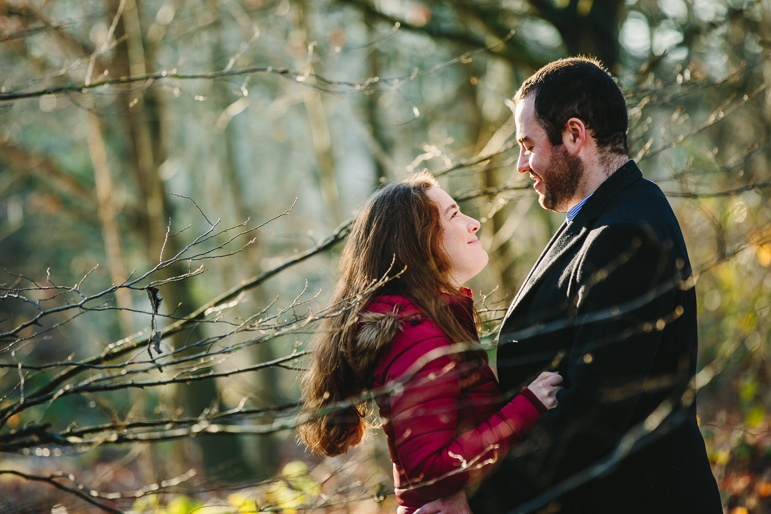 Winter engagement shoot photo of a couple in the woodlands of Alexandra palace in London